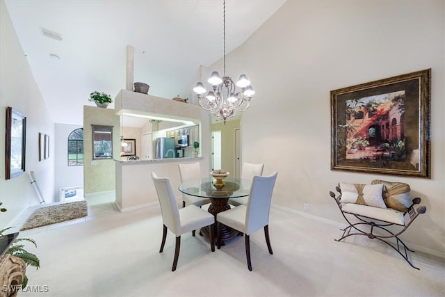 carpeted dining space with high vaulted ceiling and a notable chandelier