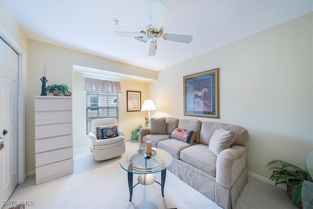 carpeted living room featuring ceiling fan