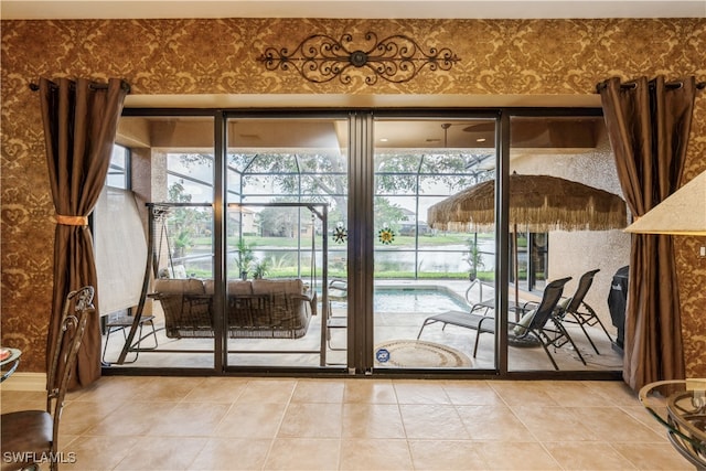 doorway to outside featuring plenty of natural light and tile patterned flooring