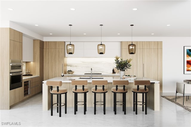 kitchen featuring a breakfast bar, decorative light fixtures, a large island with sink, and beverage cooler