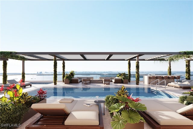 view of pool with a patio area, a water view, and an outdoor hangout area