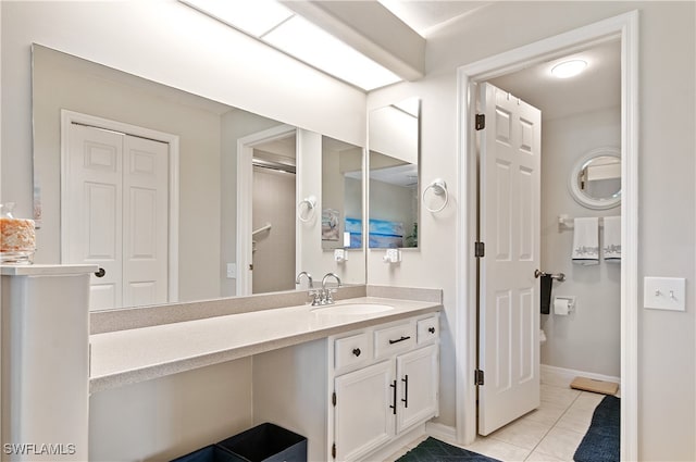 bathroom with vanity and tile patterned floors