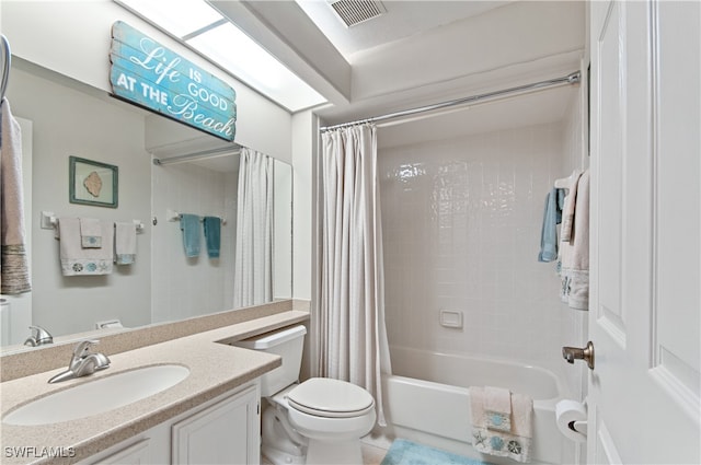 full bathroom with vanity, shower / tub combo, toilet, and tile patterned flooring