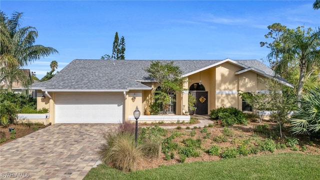 single story home with a garage