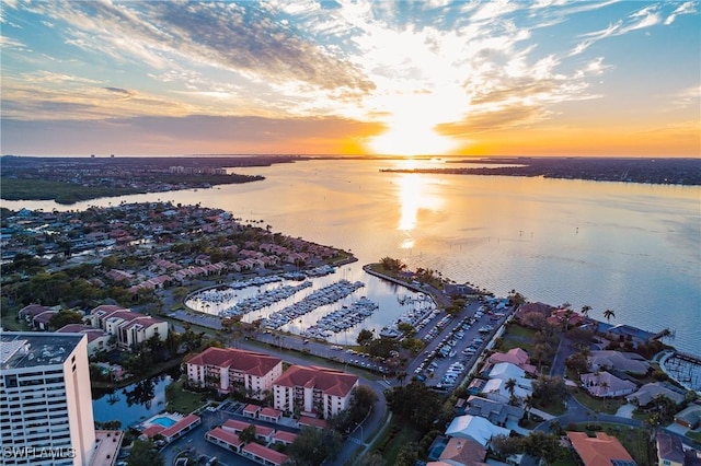 aerial view at dusk with a water view