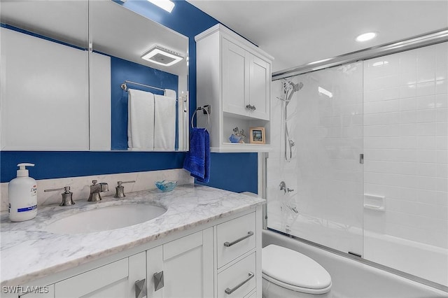 full bathroom with toilet, combined bath / shower with glass door, and vanity