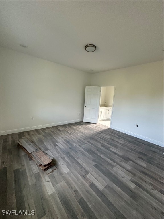 empty room featuring dark hardwood / wood-style floors