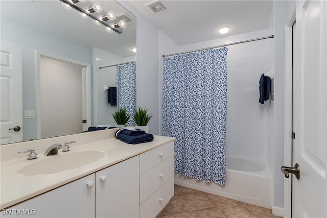 bathroom with tile patterned flooring, visible vents, shower / tub combo, and vanity