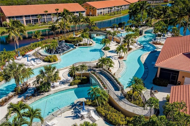 view of swimming pool featuring a water view