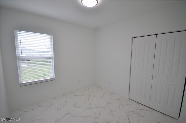 unfurnished bedroom featuring a closet