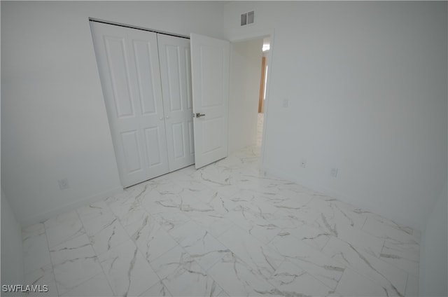 unfurnished bedroom featuring a closet