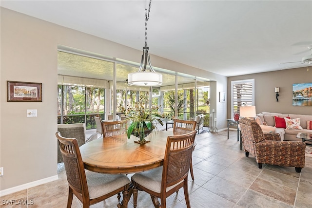 dining room with a wealth of natural light and ceiling fan