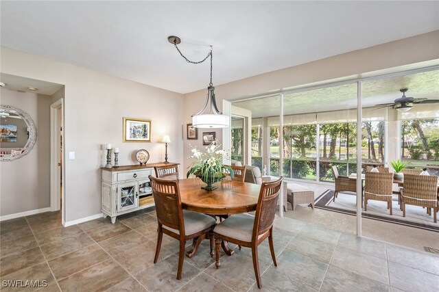 dining room featuring ceiling fan and tile patterned floors