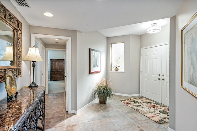760 Waterford Dr Unit 104, Naples, FL 34113 - entrance foyer with baseboards and visible vents