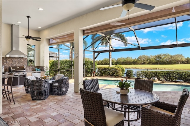 view of patio / terrace featuring an outdoor kitchen, area for grilling, a lanai, and ceiling fan