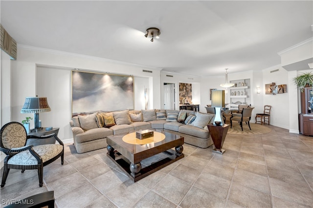 living room featuring crown molding