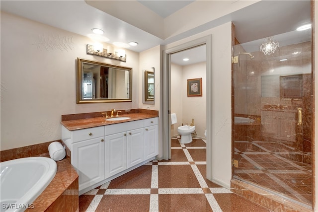 bathroom with vanity, separate shower and tub, and a bidet