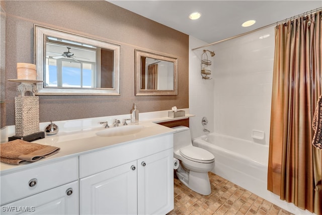 full bathroom with vanity, ceiling fan, toilet, and shower / tub combo with curtain