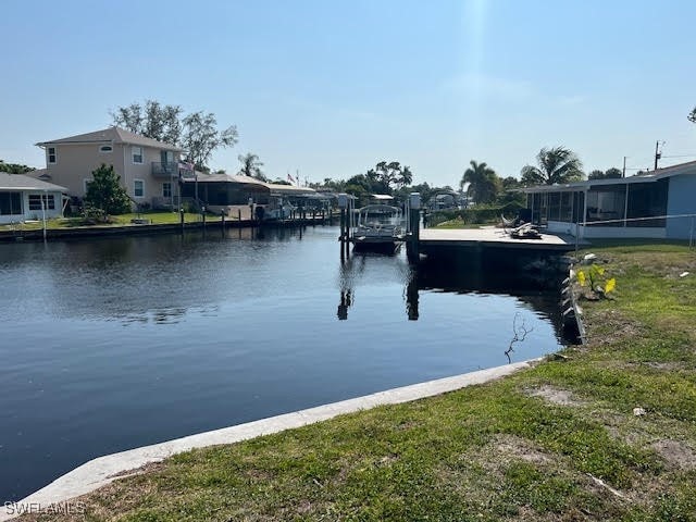 property view of water with a dock