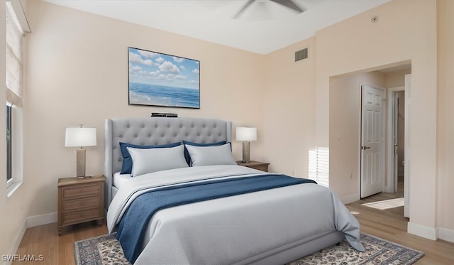 bedroom featuring visible vents, baseboards, and light wood-style flooring