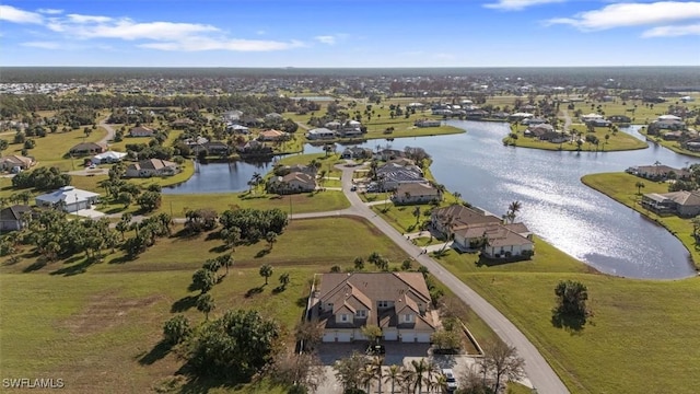 bird's eye view featuring a water view and a residential view