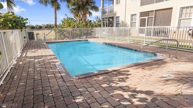 view of pool featuring a fenced in pool, a patio, and fence