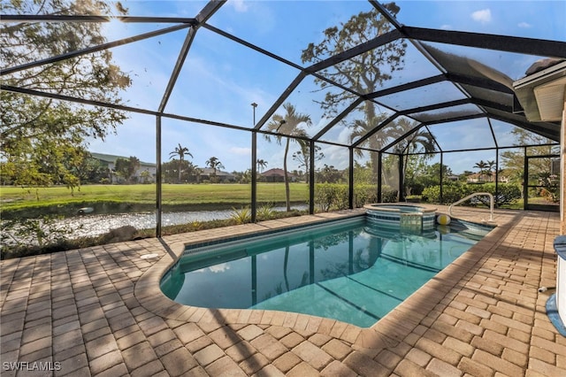 view of pool featuring glass enclosure, an in ground hot tub, a patio area, and a water view