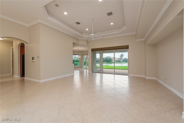 unfurnished room featuring ceiling fan, a raised ceiling, ornamental molding, and light tile patterned floors