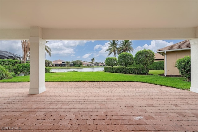 view of patio with a water view