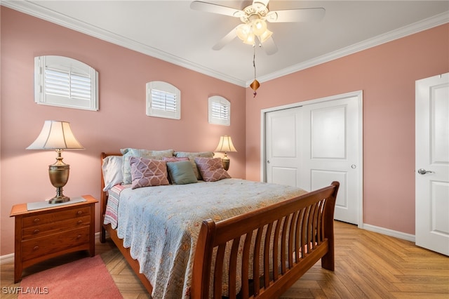 bedroom featuring ceiling fan, a closet, light parquet flooring, and ornamental molding