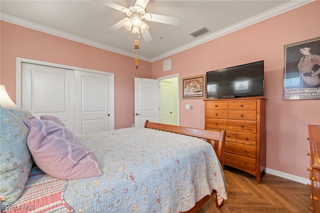 bedroom featuring parquet flooring, a closet, ceiling fan, and ornamental molding