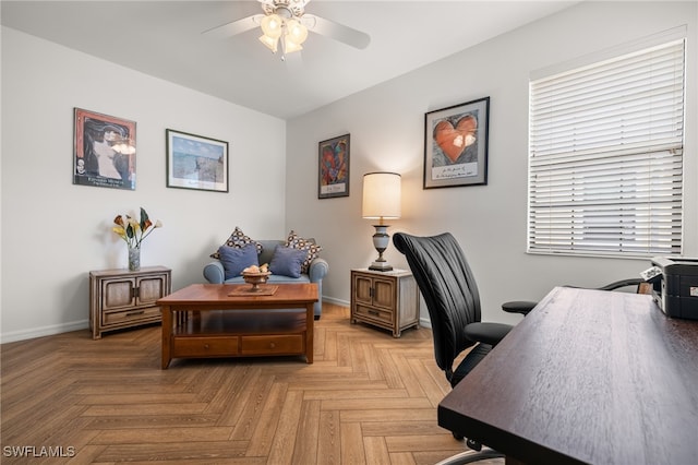 home office featuring ceiling fan and parquet floors