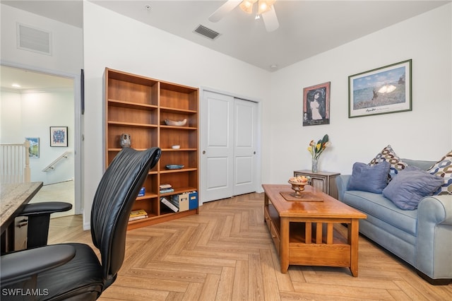 office space featuring ceiling fan and light parquet flooring