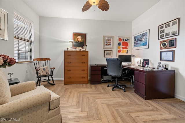 office with light parquet flooring and ceiling fan