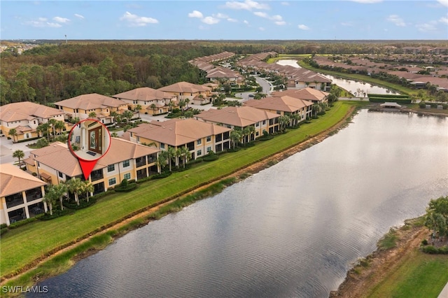 bird's eye view with a water view