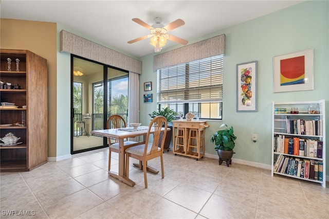 tiled dining area featuring ceiling fan