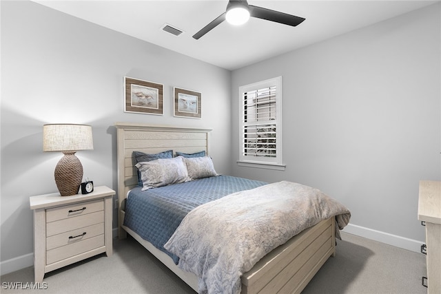 bedroom with ceiling fan and light colored carpet