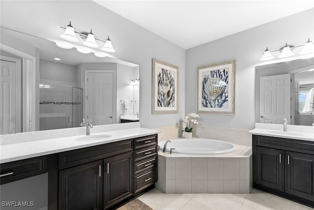 bathroom with tile patterned flooring, vanity, and independent shower and bath