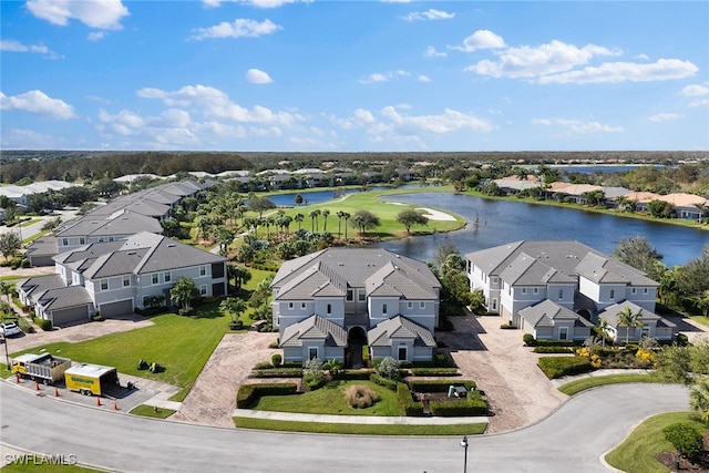 birds eye view of property with a water view