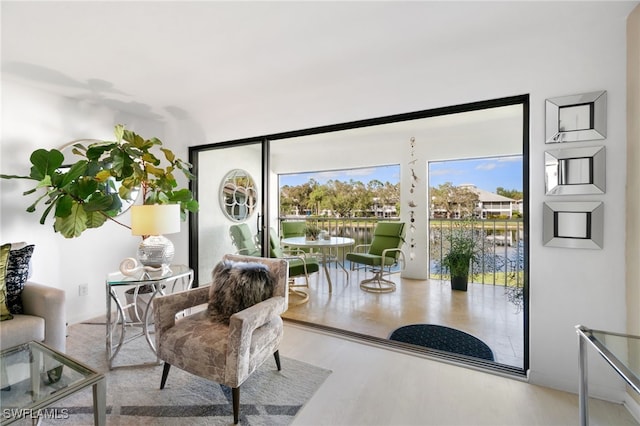 interior space featuring hardwood / wood-style floors and a water view