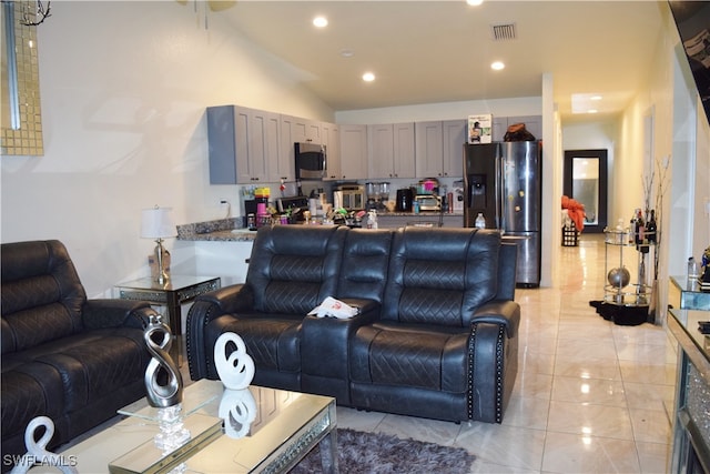 living room featuring vaulted ceiling