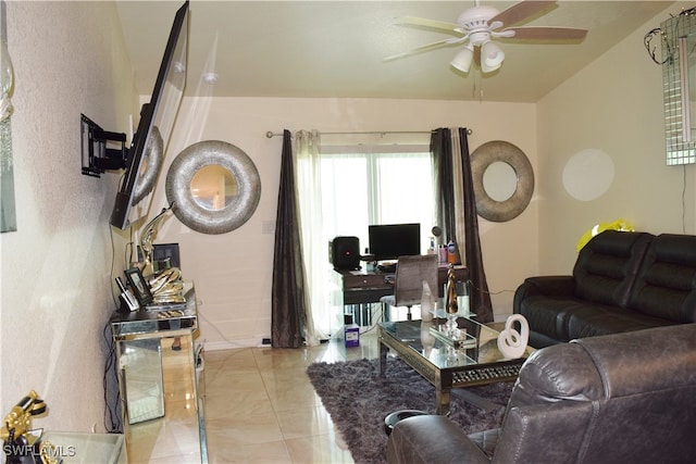 tiled living room with ceiling fan