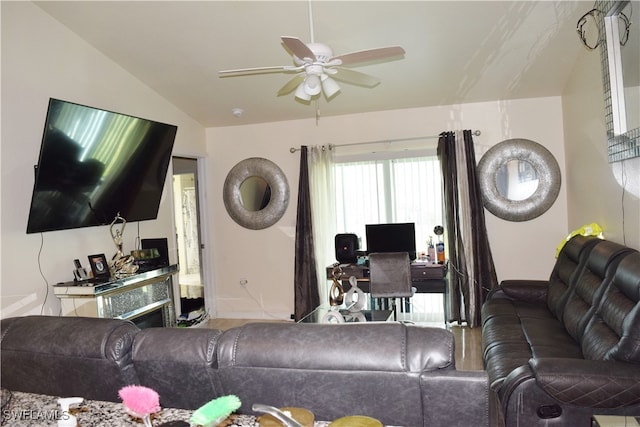 living room with ceiling fan and lofted ceiling