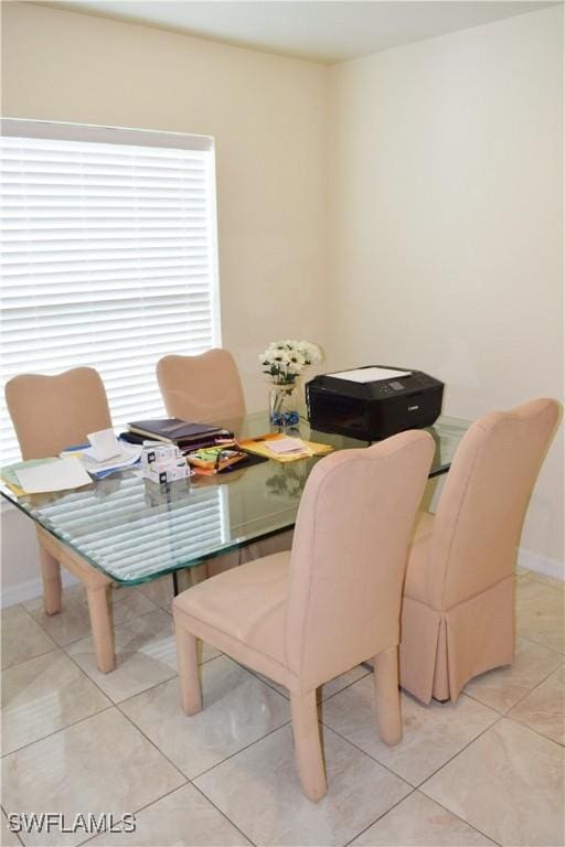 dining space with light tile patterned floors