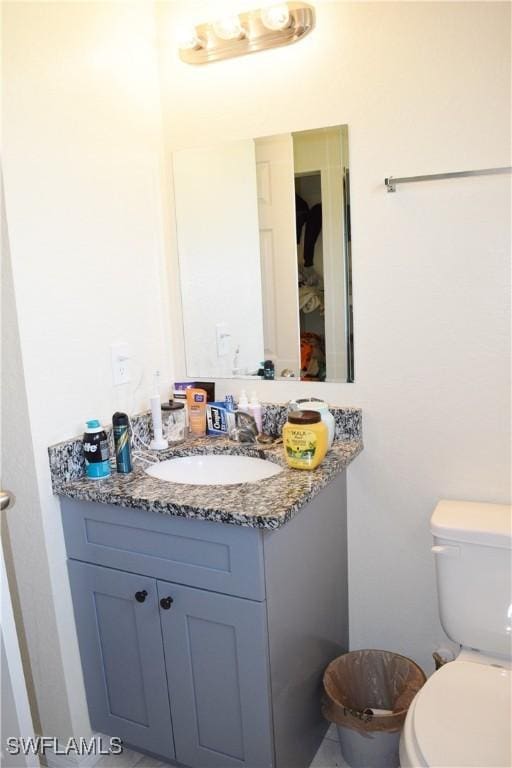 bathroom with vanity and toilet