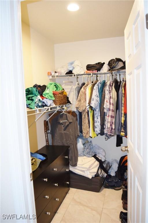 walk in closet featuring light tile patterned floors