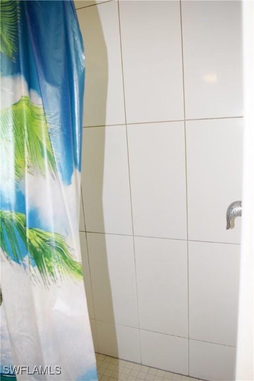 bathroom with a shower with shower curtain