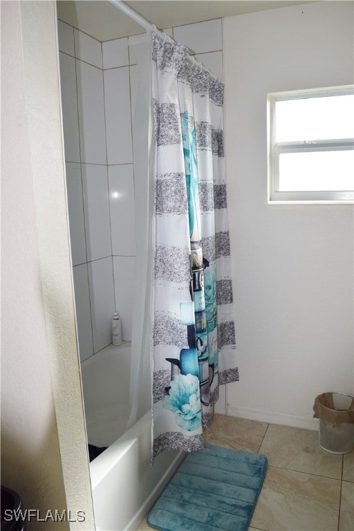 bathroom featuring shower / tub combo with curtain and tile patterned flooring