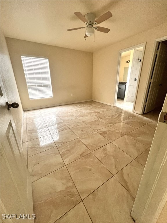 spare room with ceiling fan