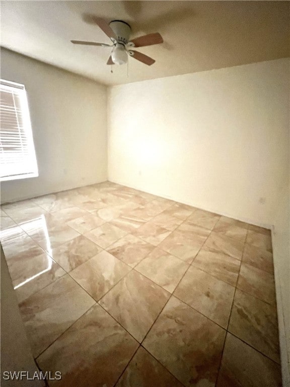 unfurnished room featuring ceiling fan